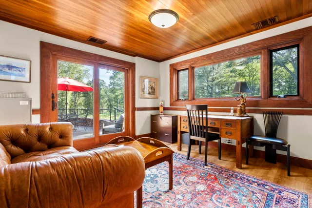 a living room with furniture fireplace and a table