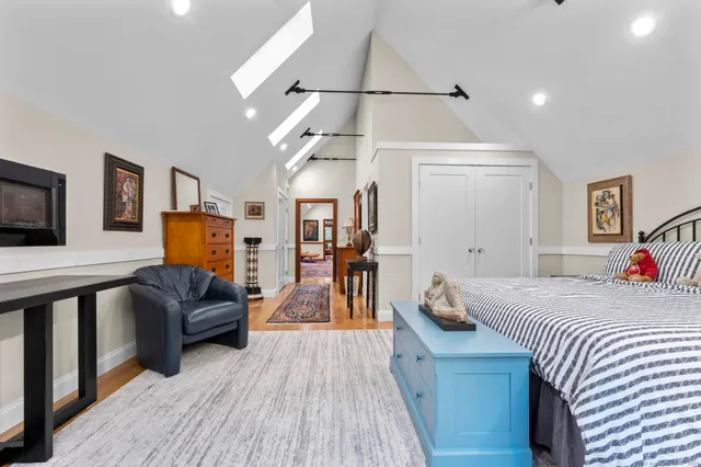 a living room with furniture and a dining table