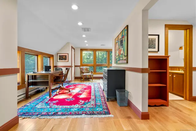a living room filled with furniture and a rug