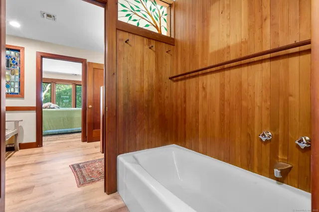 a living room with furniture and a book shelf