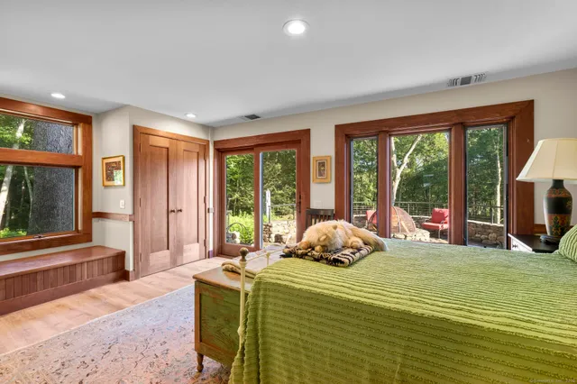 a bedroom with a bed and a dresser