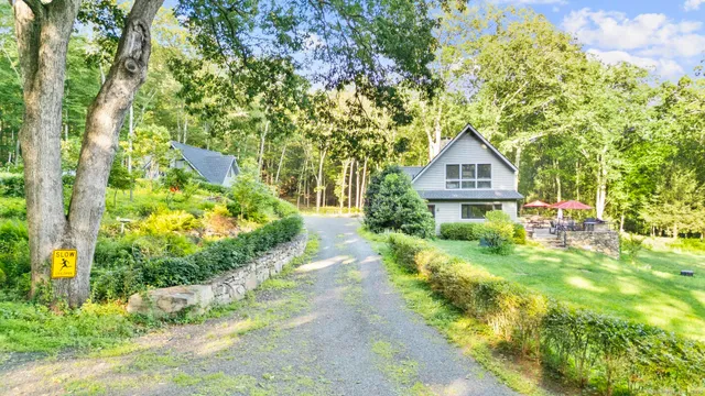 a view of a house with a yard and plants