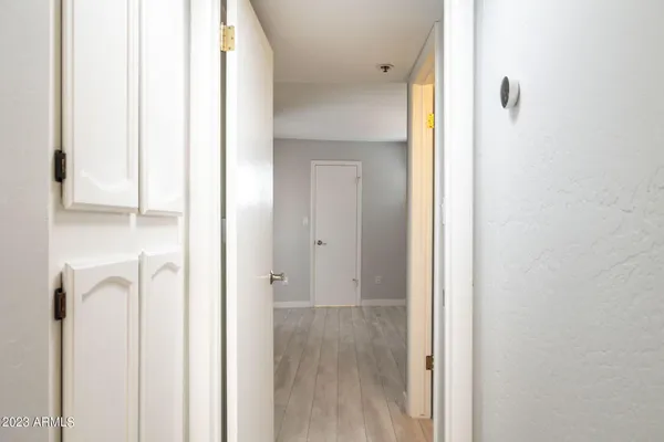 a view of a bathroom from a corridor