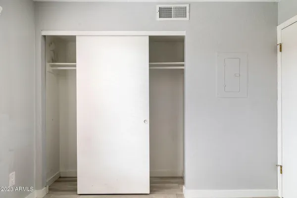 a view of a hallway with closet