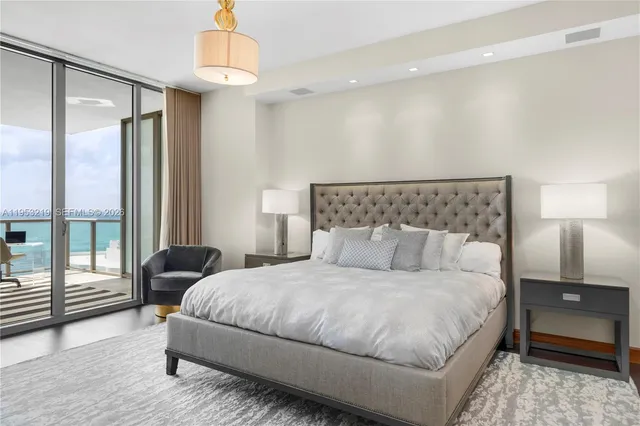 a bedroom with double bed and a window