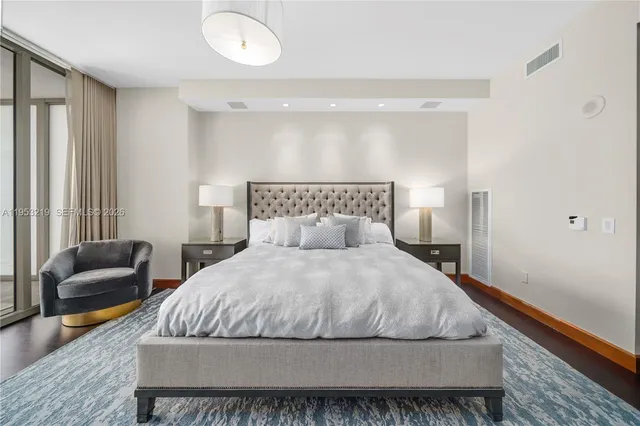 a bedroom with a bed and a couch