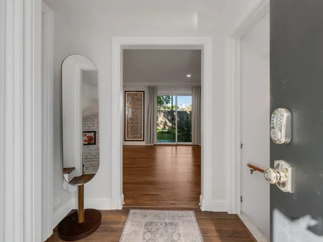 a view of gallery with wooden floor