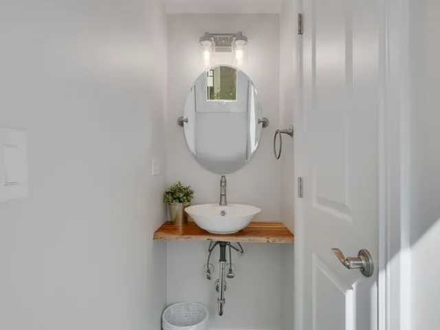 a bathroom with a sink and mirror