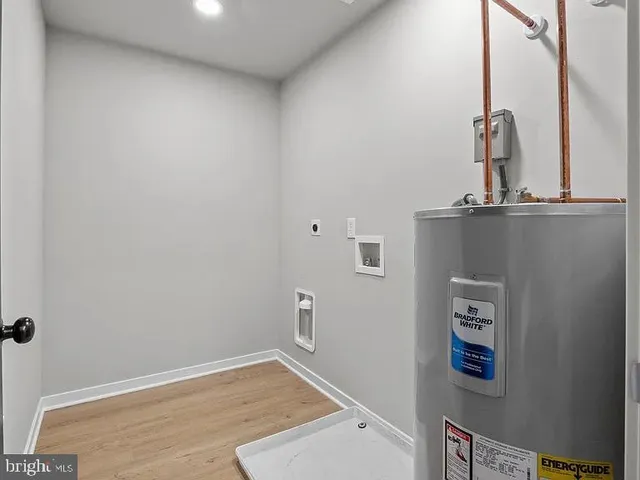 a view of a bathroom with sink and mirror