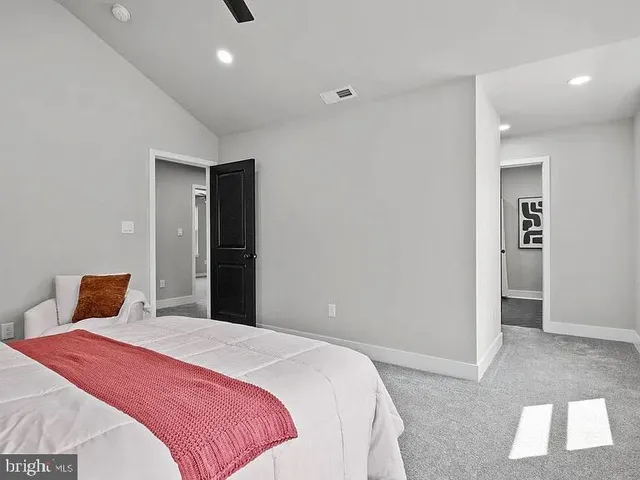 a bedroom with a bed and a walk in closet