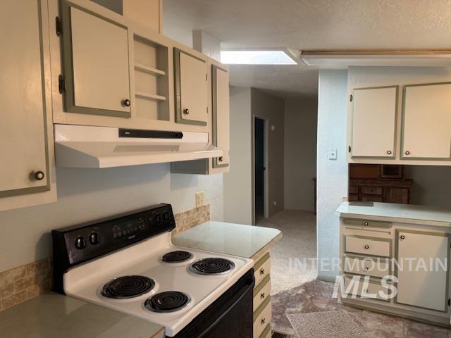 910 Moonglo, Unit 49 Buhl, ID 83316 - Photo 8 of 16 Kitchen featuring range with electric stovetop, light countertops, and open shelves