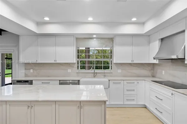 a kitchen with a sink stove and refrigerator