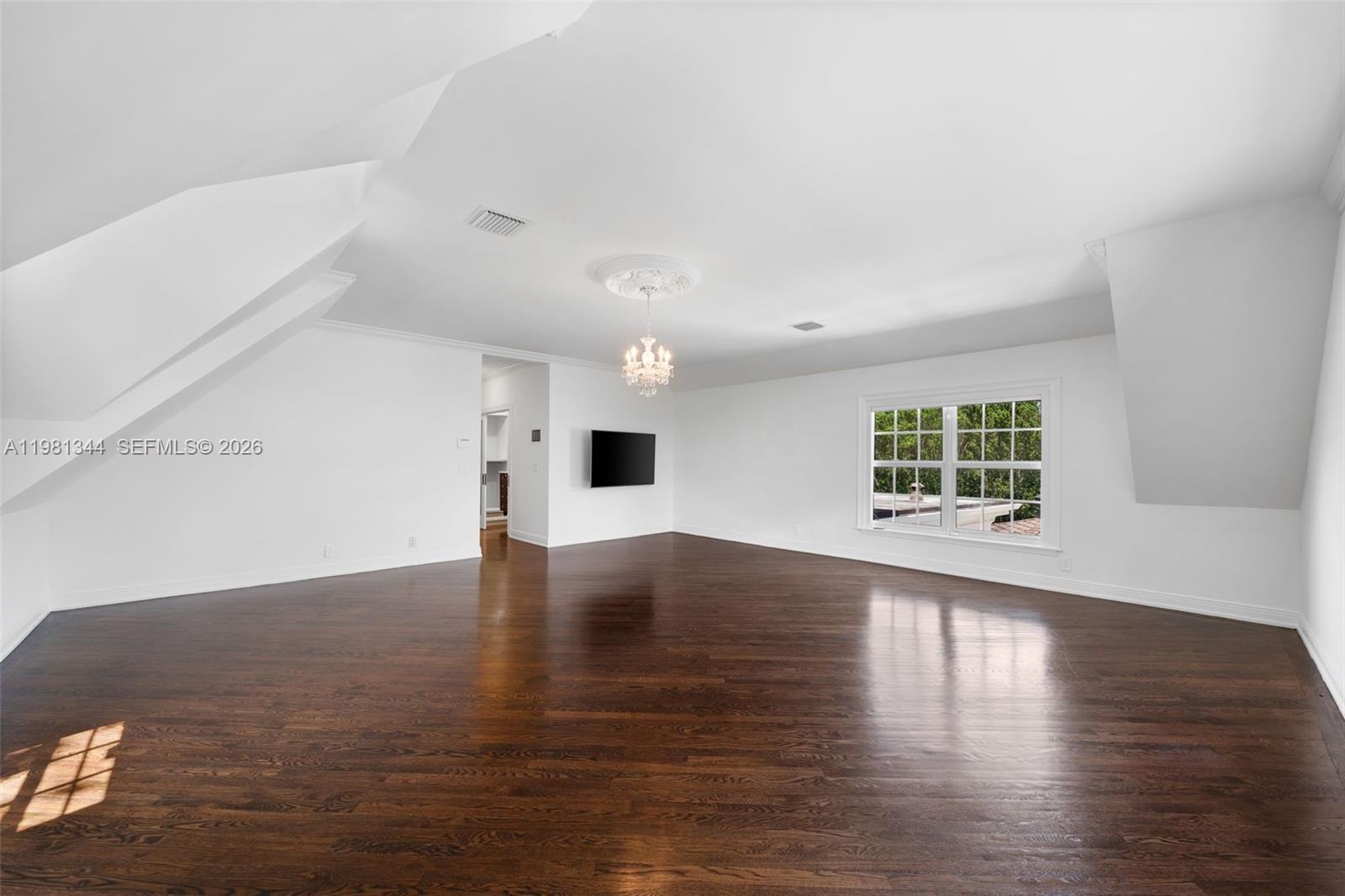 6320 Hancock Road Southwest Ranches, FL 33330 - Photo 24 of 58 a view of an empty room with wooden floor and a window