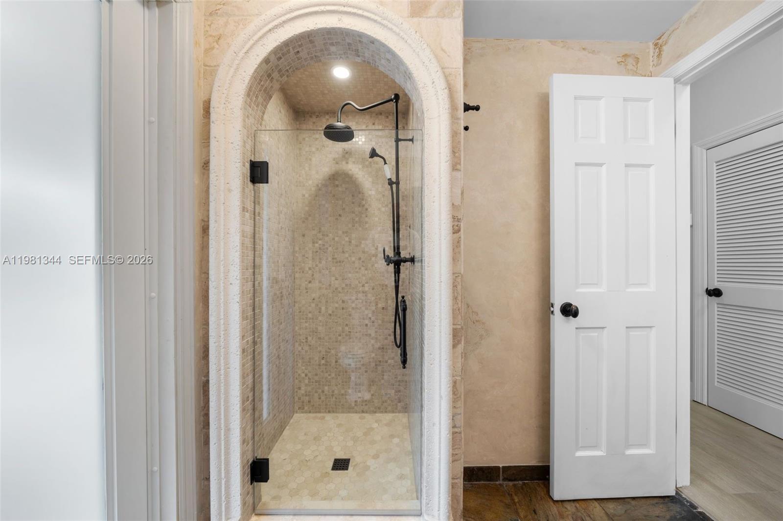 6320 Hancock Road Southwest Ranches, FL 33330 - Photo 29 of 58 a bathroom with a glass shower door and a sink