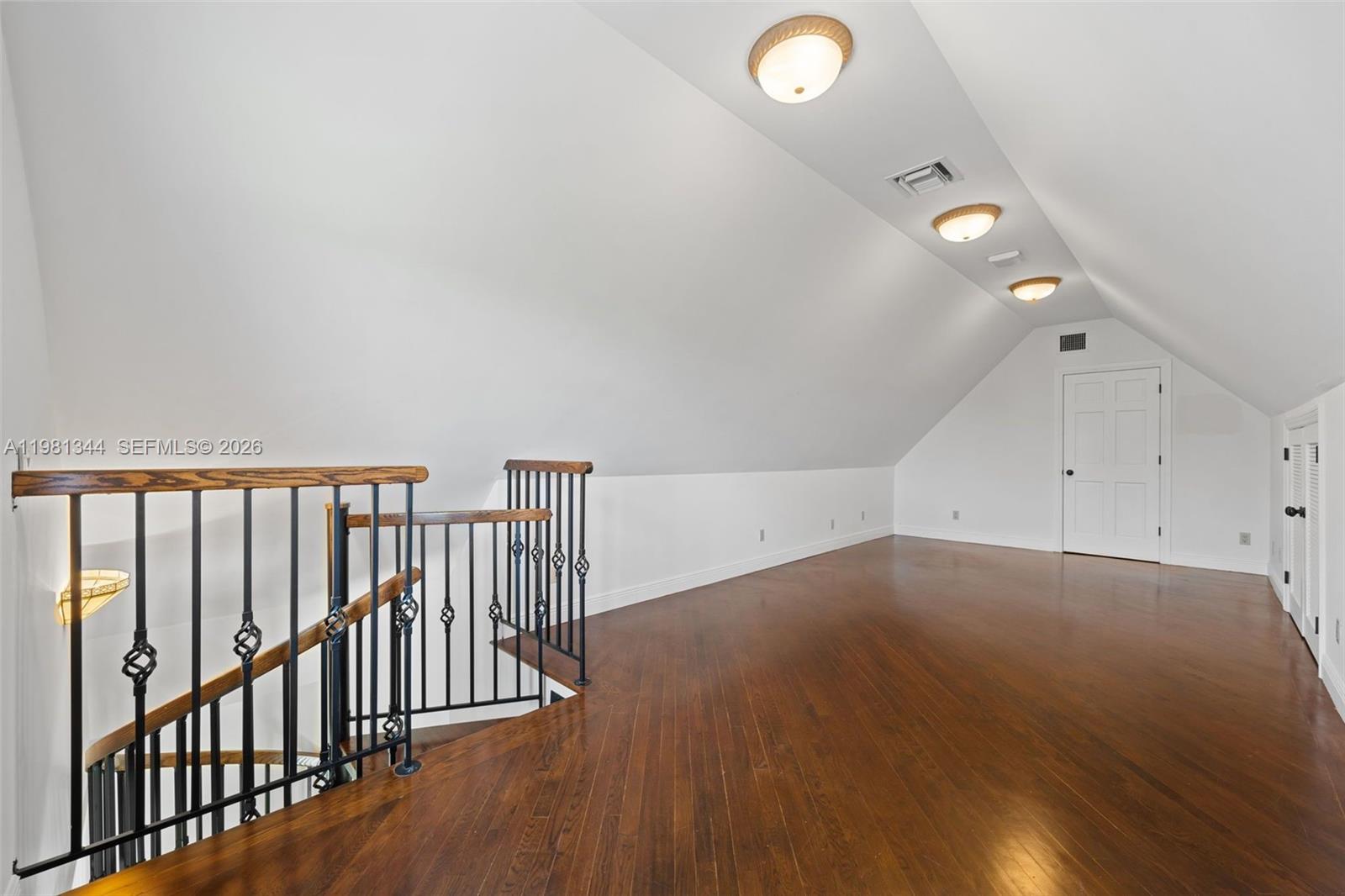 6320 Hancock Road Southwest Ranches, FL 33330 - Photo 41 of 58 an empty room with wooden floor and windows