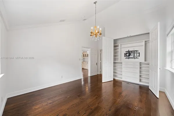 a front view of a house with swimming pool having outdoor seating