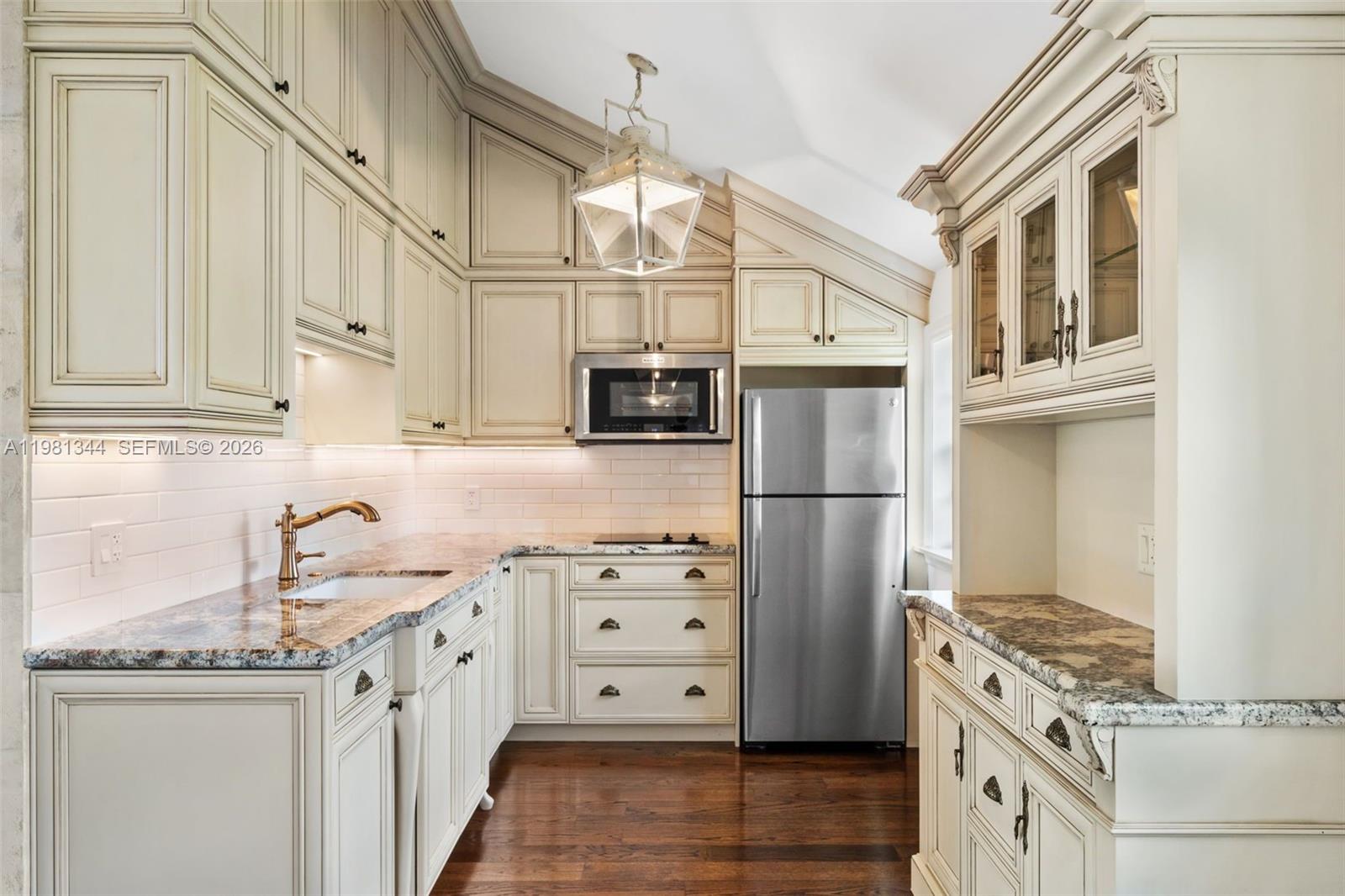6320 Hancock Road Southwest Ranches, FL 33330 - Photo 48 of 58 a kitchen with stainless steel appliances granite countertop a stove and a refrigerator