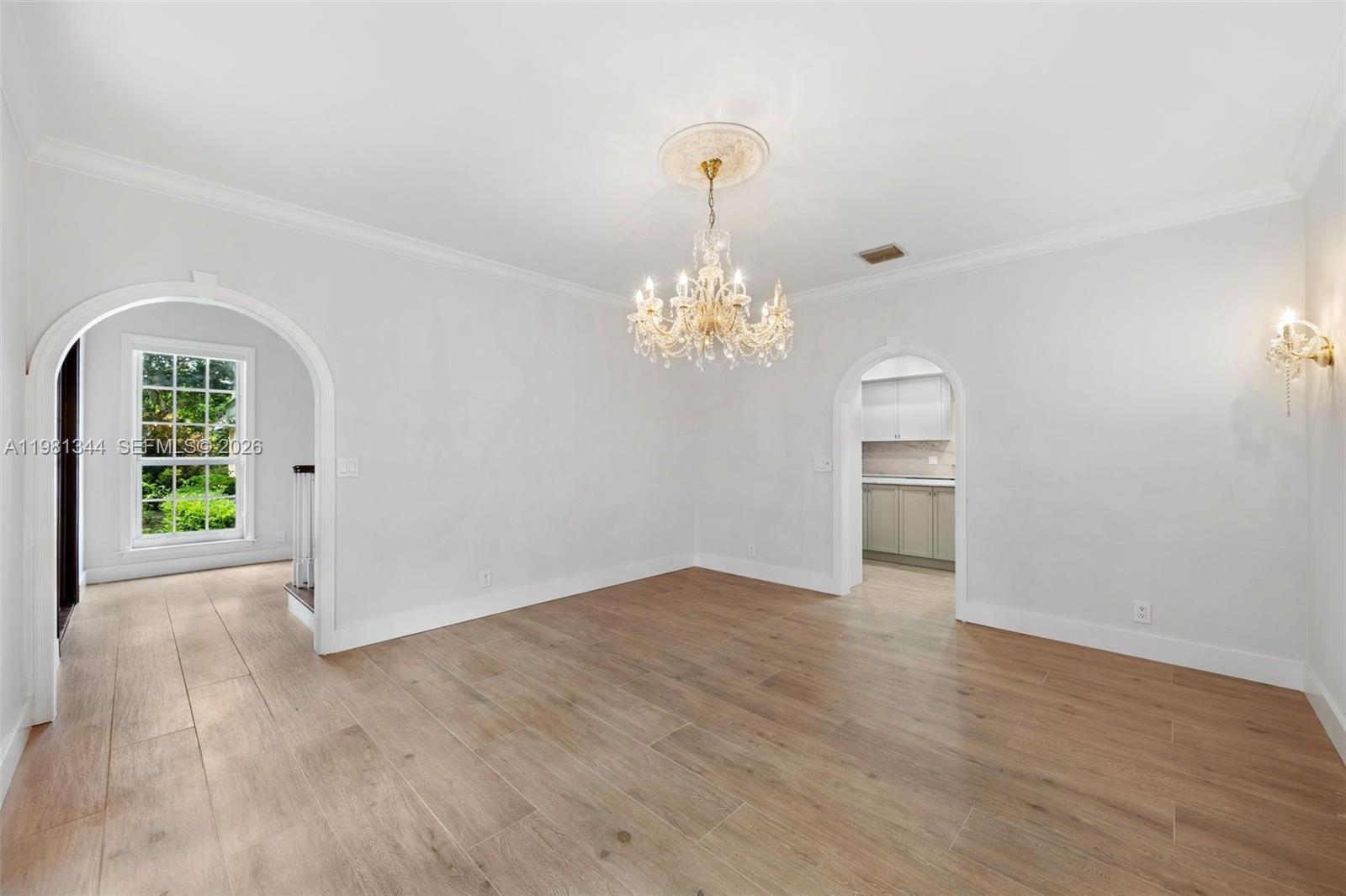 6320 Hancock Road Southwest Ranches, FL 33330 - Photo 9 of 58 a view of a room with wooden floor chandelier and windows
