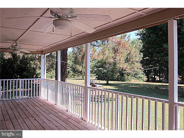 18248 Teman Road Beaverdam, VA 23015 - Photo 21 of 22 Rear covered porch with enclosed storage closet.