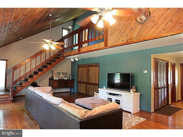 18248 Teman Road Beaverdam, VA 23015 - Photo 5 of 22 Living Room with vaulted ceiling and exposed beams