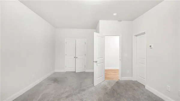 a view of a house with a wooden deck