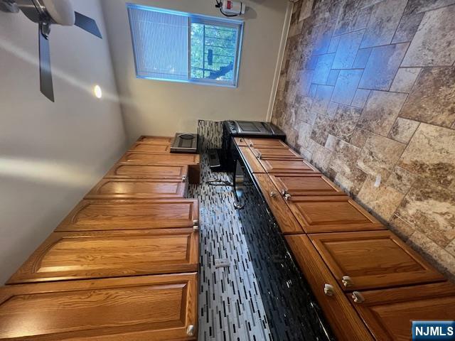 215 Orient Way, Unit B2 Rutherford, NJ 07070 - Photo 15 of 29 a kitchen with stainless steel appliances granite countertop a stove a sink and a microwave