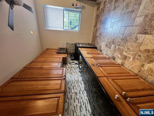 215 Orient Way, Unit B2 Rutherford, NJ 07070 - Photo 16 of 29 a kitchen with stainless steel appliances granite countertop a sink stove and cabinets