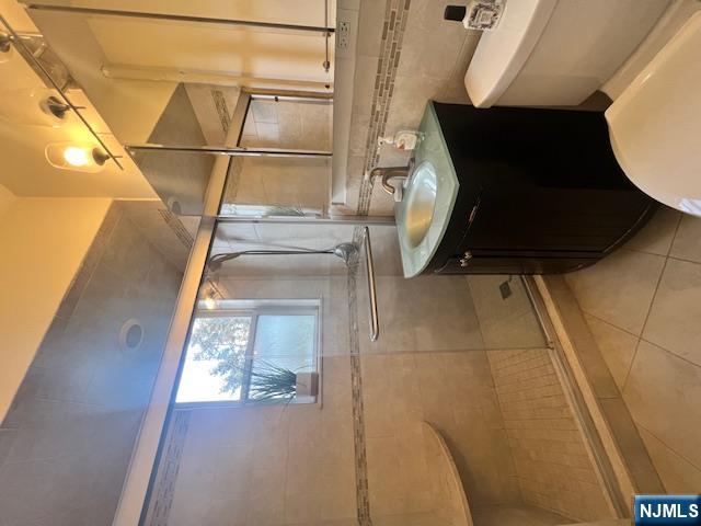 215 Orient Way, Unit B2 Rutherford, NJ 07070 - Photo 19 of 29 a bathroom with a sink a toilet and shower