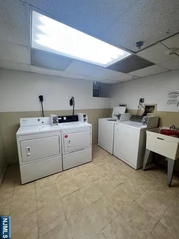 a utility room with a sink a washer and dryer