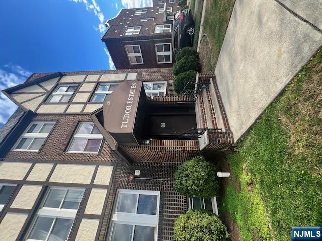 215 Orient Way, Unit B2 Rutherford, NJ 07070 - Photo 29 of 29 a front view of a brick building with a yard