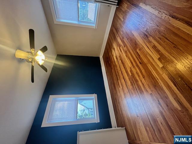 215 Orient Way, Unit B2 Rutherford, NJ 07070 - Photo 3 of 29 a view of an empty room with wooden floor and a window