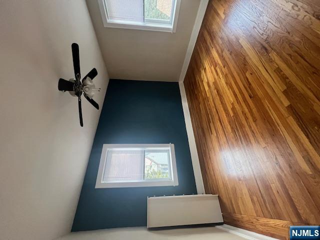215 Orient Way, Unit B2 Rutherford, NJ 07070 - Photo 7 of 29 a view of empty room with wooden floor and fan