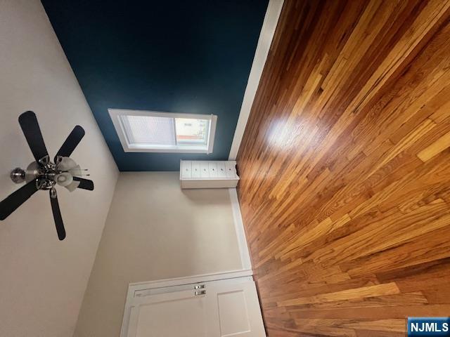 215 Orient Way, Unit B2 Rutherford, NJ 07070 - Photo 8 of 29 a view of an empty room with window and wooden floor