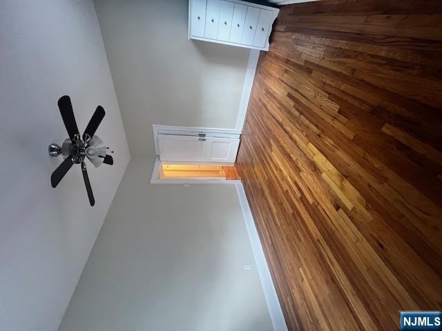 215 Orient Way, Unit B2 Rutherford, NJ 07070 - Photo 9 of 29 a view of empty room with wooden floor and fan