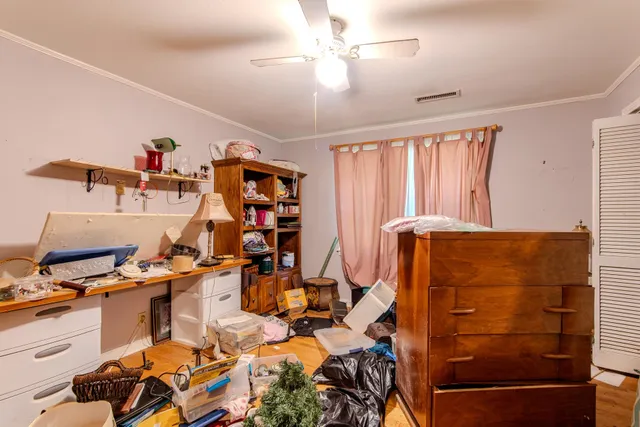 a work room with furniture and a window