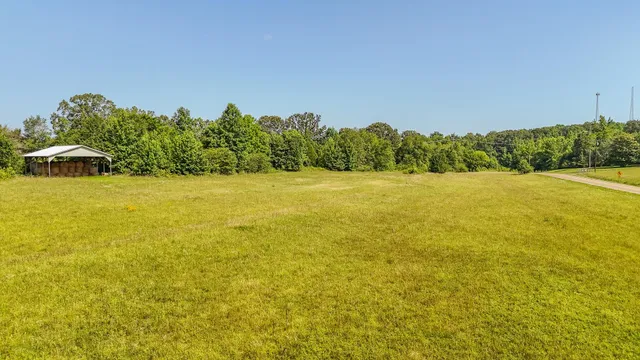a wooden fence with some trees in the background