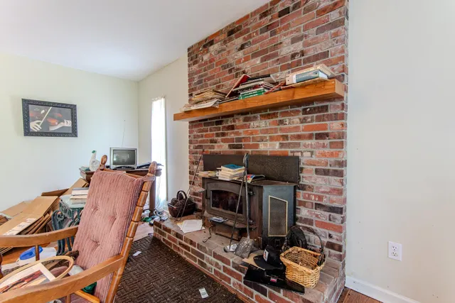 a room with furniture and a fireplace