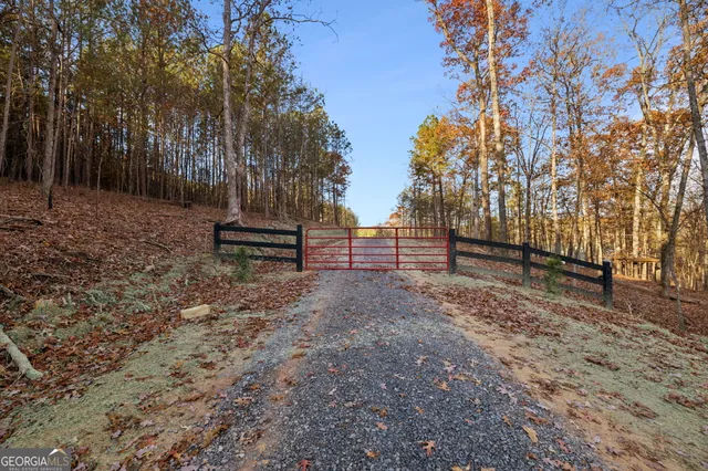 a view of outdoor space with wooden fence