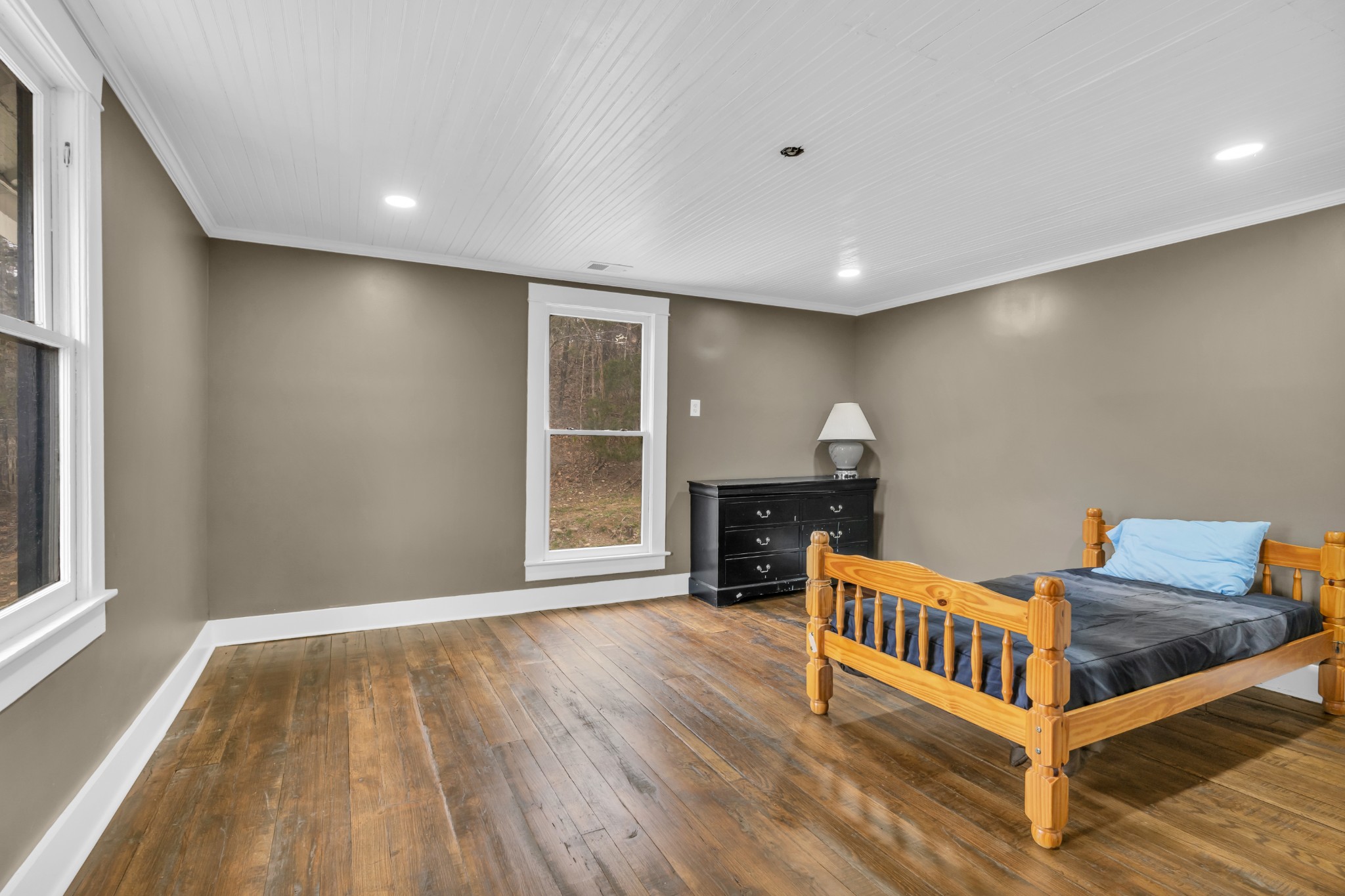 3039 Pigg Hollow Road Petersburg, TN 37144 - Photo 23 of 38 a view of an empty room with wooden floor and a window