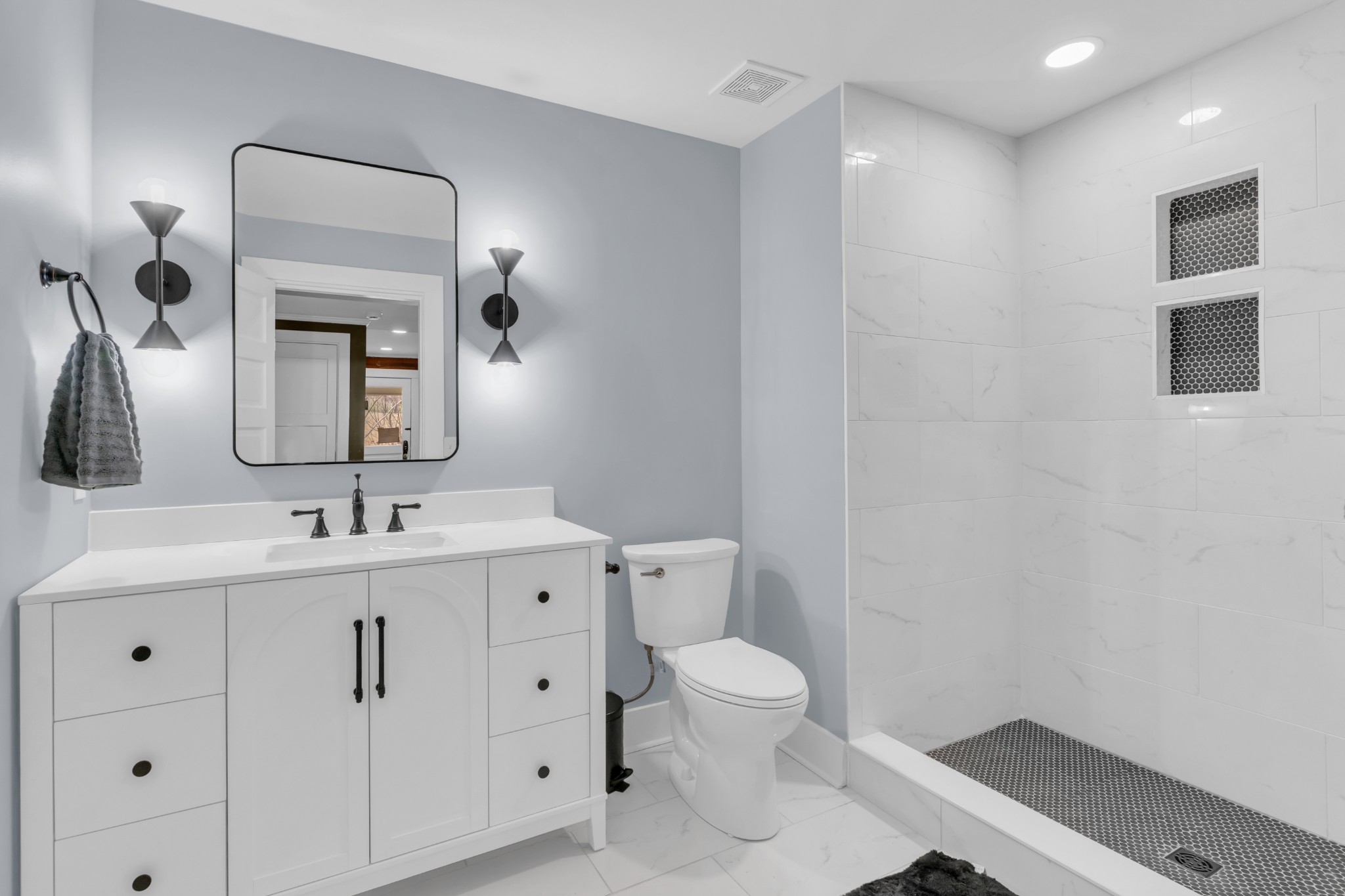 3039 Pigg Hollow Road Petersburg, TN 37144 - Photo 29 of 38 a bathroom with a toilet sink and mirror