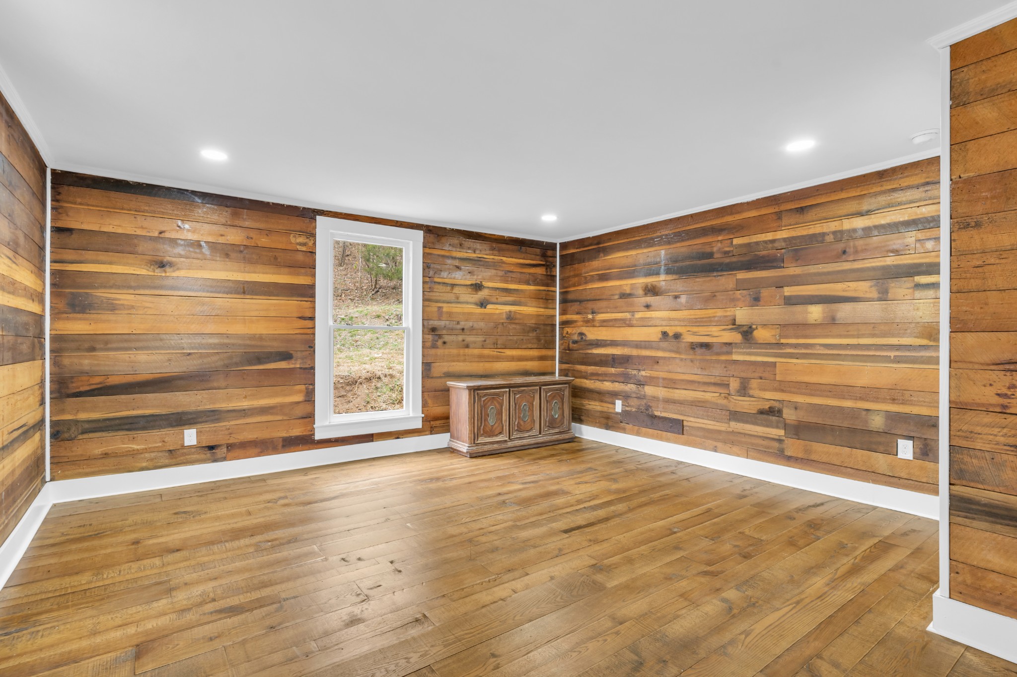 3039 Pigg Hollow Road Petersburg, TN 37144 - Photo 31 of 38 a view of an empty room with a window and wooden floor