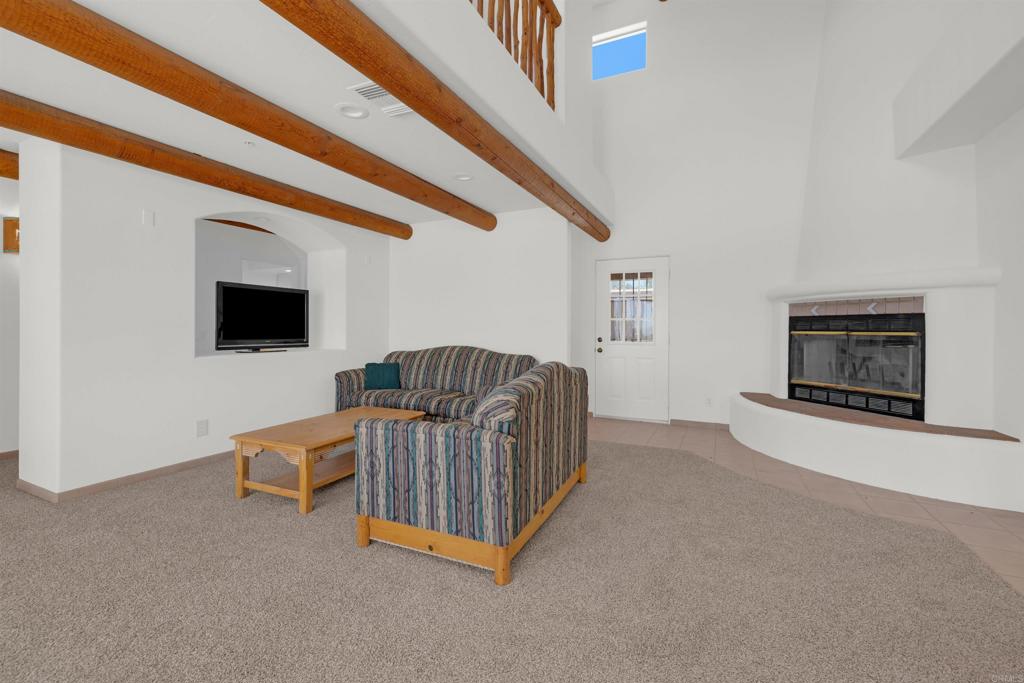 6226 Split Mountain Road Borrego Springs, CA 92004 - Photo 11 of 57 a living room with furniture and a flat screen tv