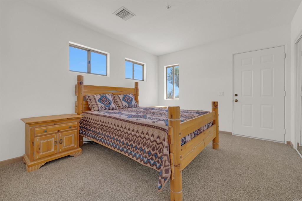 6226 Split Mountain Road Borrego Springs, CA 92004 - Photo 20 of 57 a bed room with a bed and a couch
