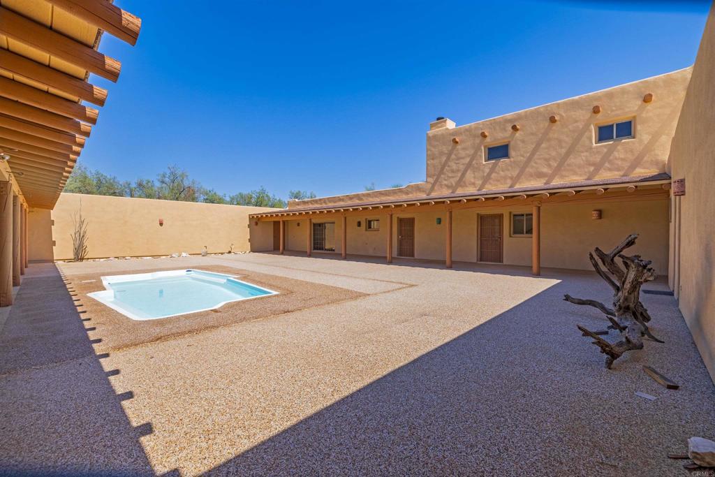 6226 Split Mountain Road Borrego Springs, CA 92004 - Photo 30 of 57 a view of a house with a swimming pool