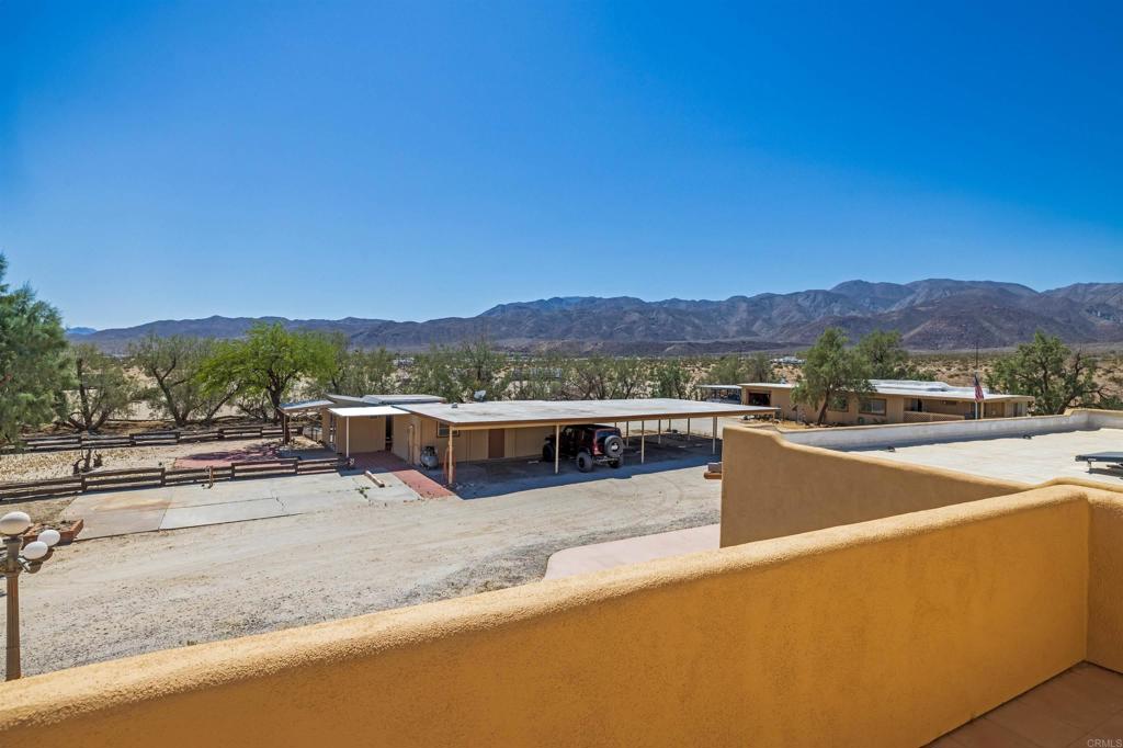 6226 Split Mountain Road Borrego Springs, CA 92004 - Photo 33 of 57 a view of a terrace with a table and chairs
