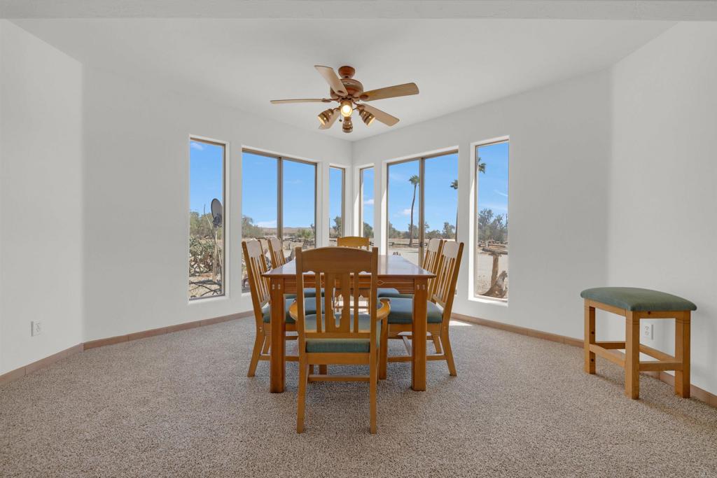 6226 Split Mountain Road Borrego Springs, CA 92004 - Photo 8 of 57 a view of a dining room with furniture and a chandelier fan
