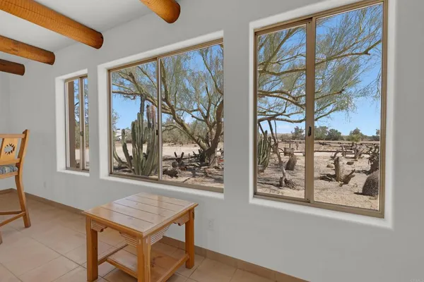 a spacious bathroom with a double vanity sink a mirror and a bathtub