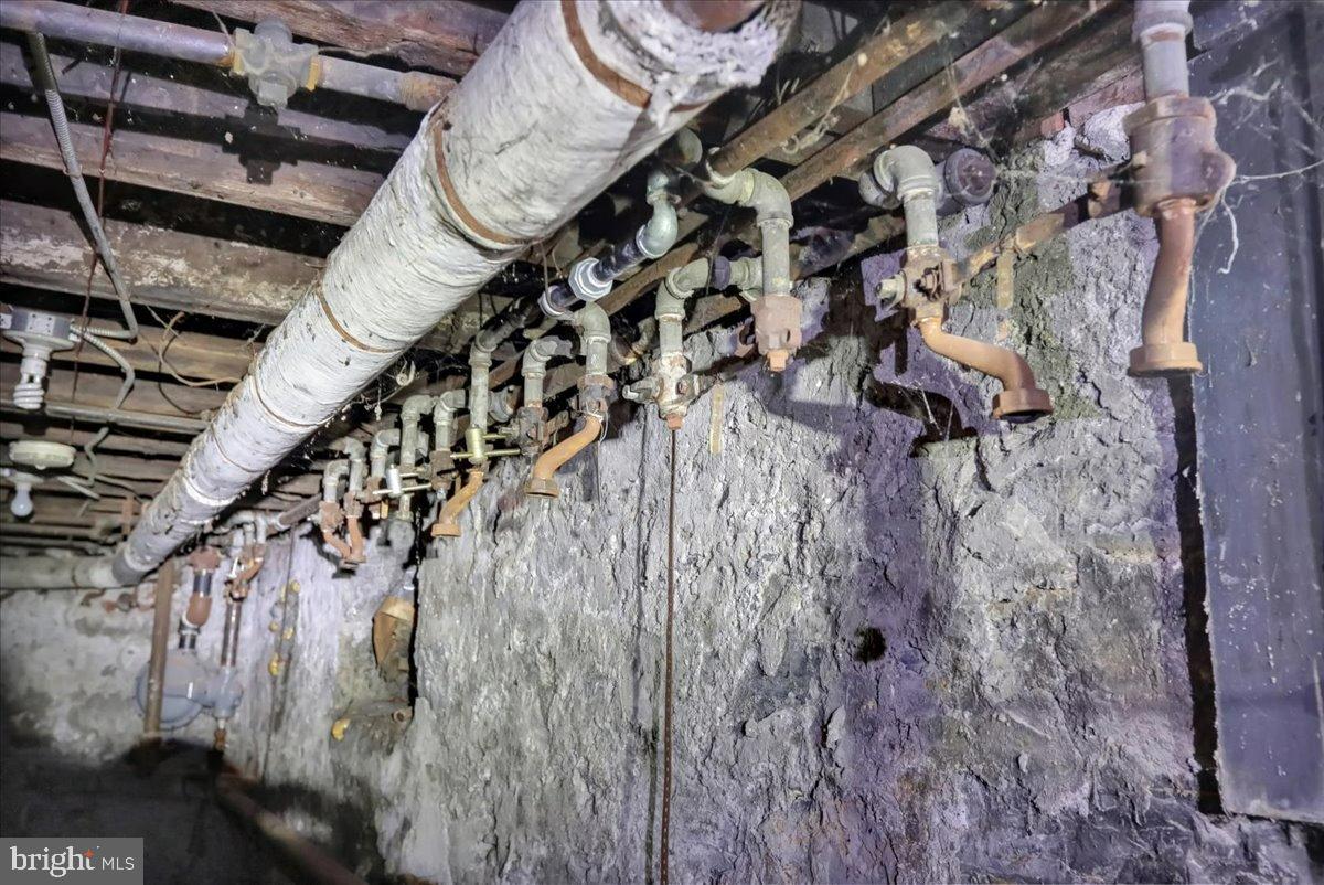 200 West Lancaster Avenue Reading, PA 19607 - Photo 20 of 50 Industrial pipes in a dimly lit basement.
