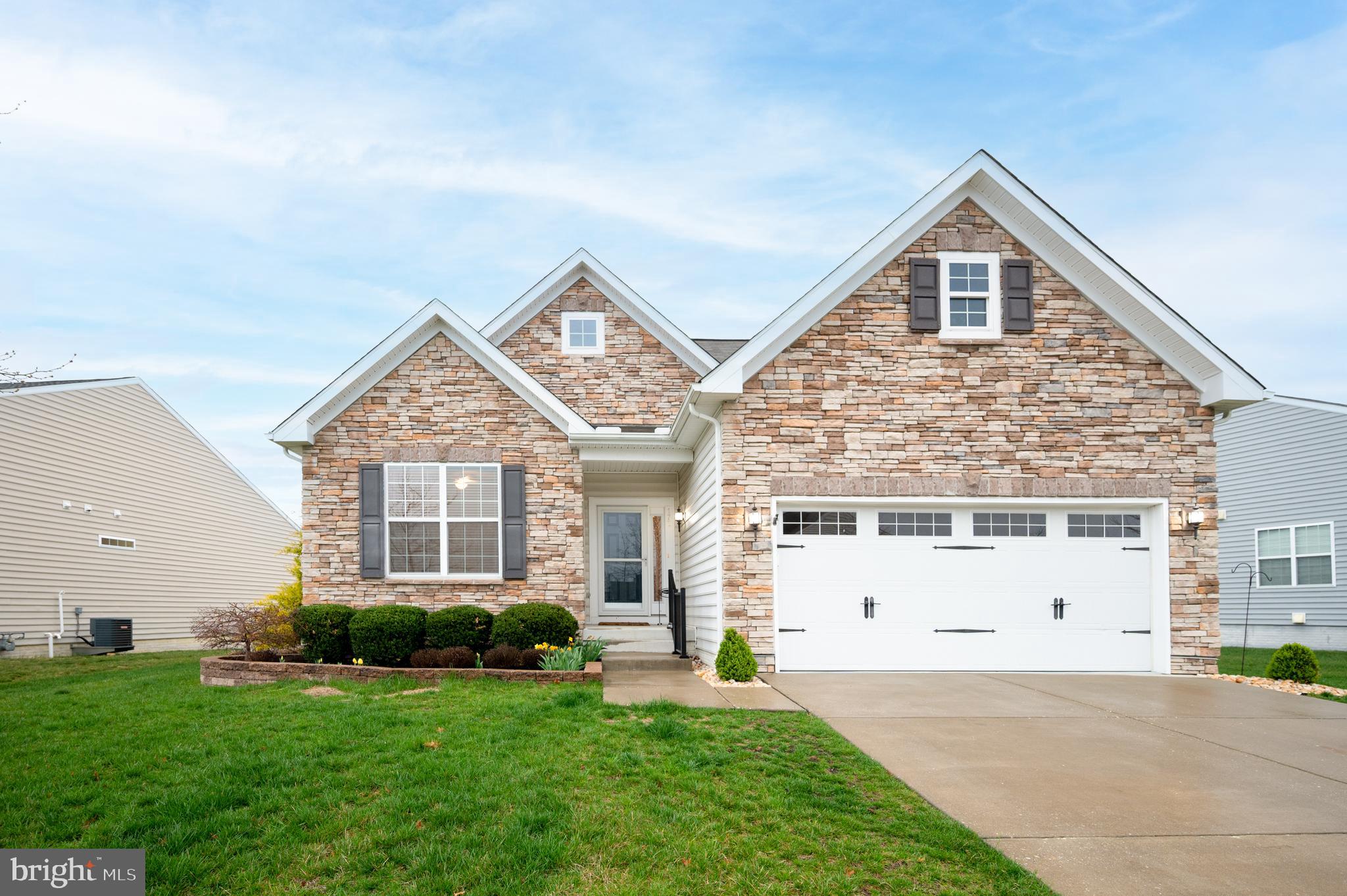 a view of house with yard and front view of a house