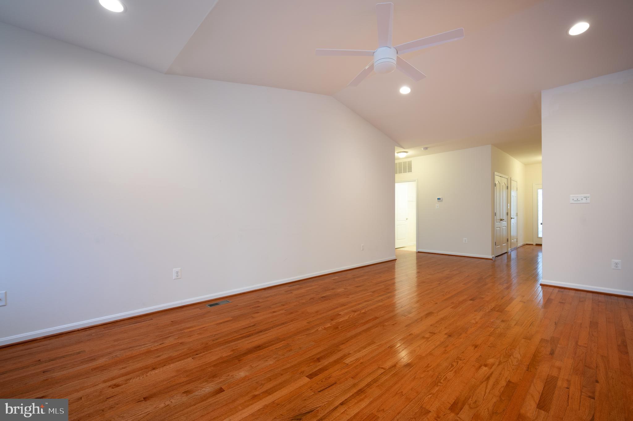 173 Silver Maple Road Middletown, DE 19709 - Photo 13 of 36 a view of an empty room with wooden floor and closet